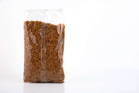 Buckwheat, groats in a plastic bag isolated on a white background. Copy space.の写真素材