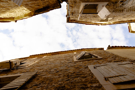 Cozy windows in the old town of Budva, Montenegro. Bottom view.の写真素材