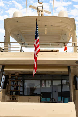 American flag on a boat moored in the harbor, marina. The Adriatic Sea.