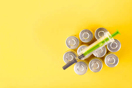 Bubbles, ampoules with dry probiotic, bifidobacteria, with probiotic powder inside on a yellow background. Copy space.の写真素材