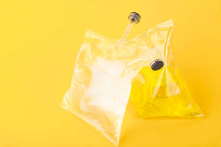 Medical saline solution, furacilin isolated on yellow background in soft silicone packaging.の写真素材