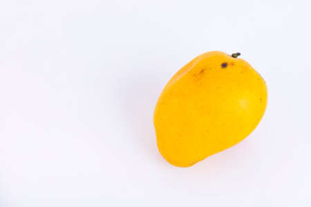 Yellow mango, favorite Thai fruit, isolated on white background. ECO, environmentally friendly product. Copy space.の写真素材