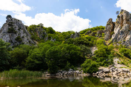 Red rock, cliff in the Gurzuf valley on the southern coast of the Crimea peninsula, located at an altitude of 430 meters above sea level.の写真素材