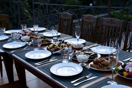 Served banquet, dining table with dishes, snacks, glasses for wine and water, European cuisine....