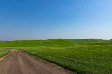 A picturesque view of the green steppe hills, pastures stretching into the distance. High quality photoの写真素材