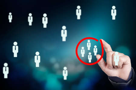 Marketing target audience concept, Businessman writing red circle to mark to focus customer group. High quality photoの写真素材