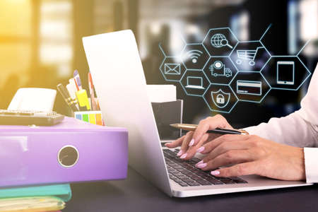 Women hand using laptop sell online to people shopping online with chat box, shopping carts, pop up...