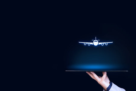 Air ticket booking on app or online travel insurance concepts. Person with digital tablet and symbol of a plane. Copy space.の写真素材