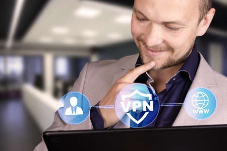 Business, technology, internet and networking concept. VPN network security internet privacy encryption concept. A man with a smile on his face and a laptop. High quality photoの写真素材