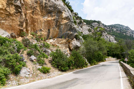 An old European road in the mountains along the rocks. Coast of the Black Sea.の写真素材