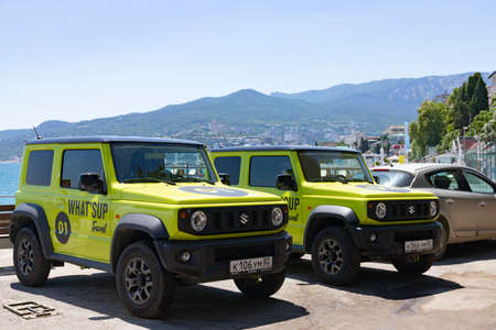 Yalta, Ukraine, July 25, 2021: Suzuki Jimmy SUV, against the backdrop of mountains and the sea