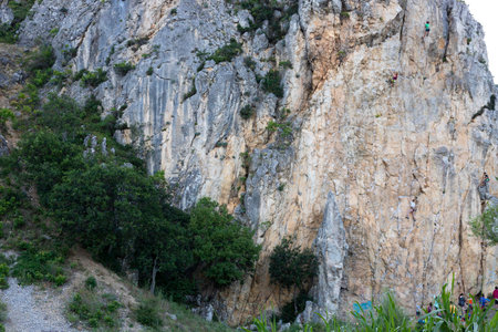 Crimea, Ukraine, July 25, 2021: A group of children are engaged in rock climbing as a sport on the...