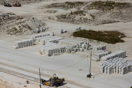 Extraction and primary processing of limestone and gypsum stone in a quarry.