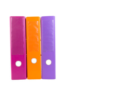 A set of three office folders in different colors. White isolated background. copyspace.