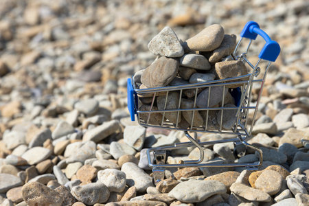 Sea Pebbles in the shopping cart. backgroundの写真素材