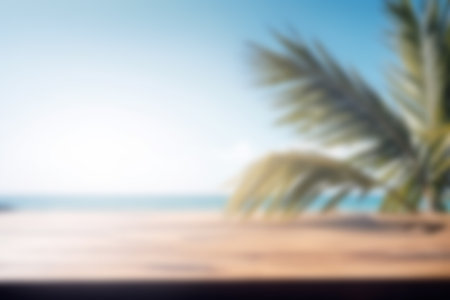 Blurred background, wooden table with a palm tree on the background of the sea. copyspace.