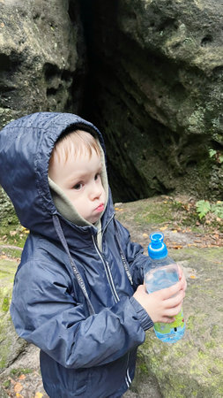 Selfies, Mom taking photos of her son with her phone, in the fall in the mountains of Poland.の写真素材