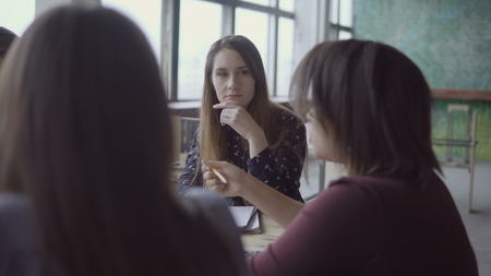 Young and perspective mixed race team discussing new project. Creative group of people working on start-up idea.の写真素材