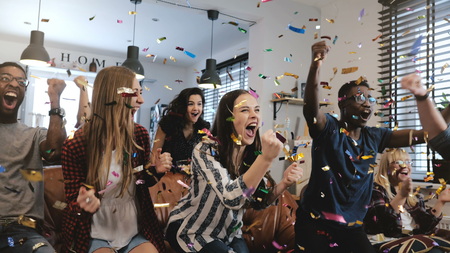 Emotion. Multi-ethnic fans celebrate winning.の写真素材