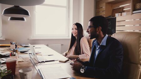 Multiethnic business representatives negotiation. Young office workers negotiate business company agreement terms 4K.の写真素材
