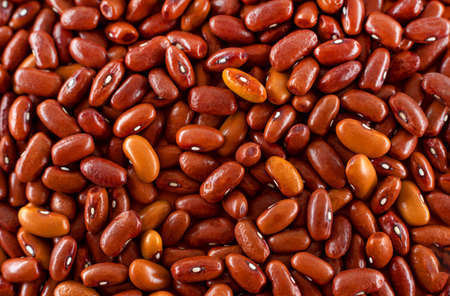 Background of many grains of dried beans. The texture of brown beans. Food background. Bean...