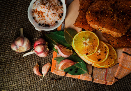 Still-life. Pieces of salted meat with lemon and garlic. Corned beefの写真素材