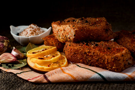 Still-life. Pieces of salted meat with lemon and garlic. Corned beefの写真素材