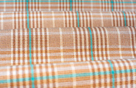 Fabric.Checkered fabric. Checkered pattern on fabric of different colors. Material for clothingの写真素材