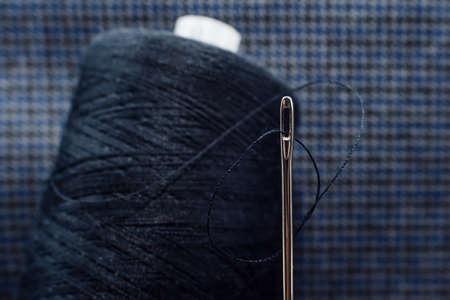 Needle and thread close-up. Macro. Items for the work of a tailor and seamstress. Craftsの写真素材