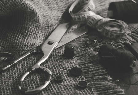 Sewing Thimble. Needle and thread. Scissors and a centimeter are the tools of a tailor, fashion designer, seamstressの写真素材