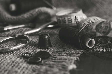 Sewing Thimble. Needle and thread. Scissors and a centimeter are the tools of a tailor, fashion designer, seamstressの写真素材