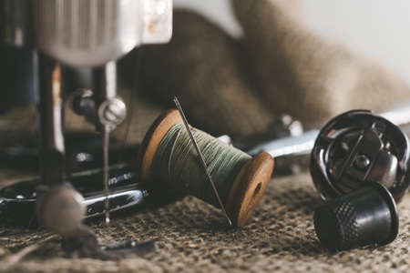 Needle and thread, scissors, sewing machine.