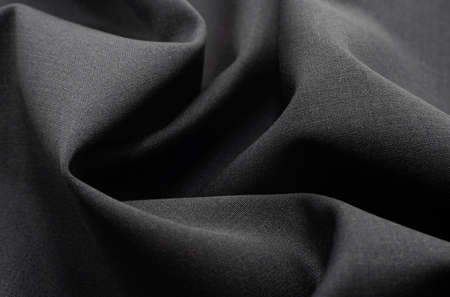 Cloth. Part of the dark fabric texture of the fabric for the background and decoration of the work...