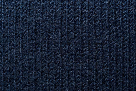 Knitted fabric background. Ornament. Close-Up knitted wool texture gray, blue