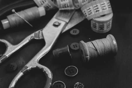 Sewing machine. Needle and thread. Thimble. Scissors. Sewing tools for fashion designers, designers, and seamstresses. Tailoring.の写真素材