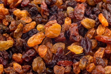 Raisin. Background of dried grapes berries with seeds close up