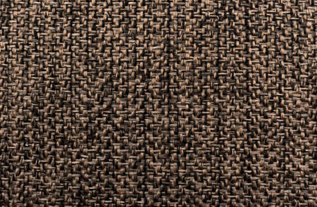 The texture of a brown ribbed fabric with a large knit. Thick material for carpet or furnitureの写真素材