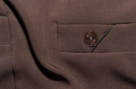 Pocket on women's clothing, brown trousers. Part of women's clothing or accessory