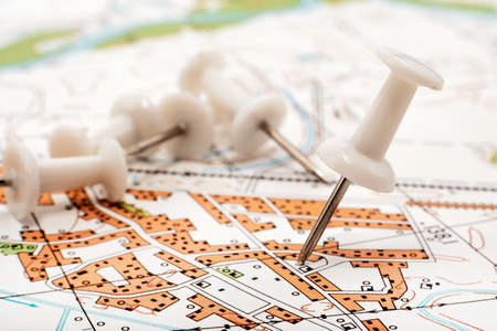 A paper clip on the map shows the end point of the route. travel guide. Map of the city, areaの写真素材