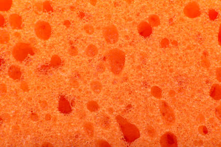 Background of moisture-absorbing orange sponges. Porous water-absorbing material or fabric. spongeの写真素材
