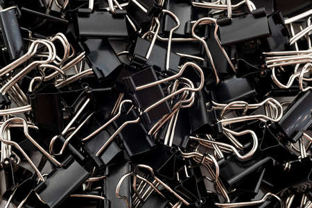Background of black paper pins close-up. stationeryの写真素材