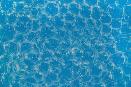 Soap bubbles background. Shampoo foam. Bubbles in the water