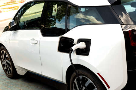 Electric car at the charging station. Ecology. Eco friendly transport