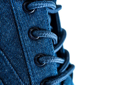 Shoe laces. Lace-up casual or sports shoes close-up on a white background. shoes background
