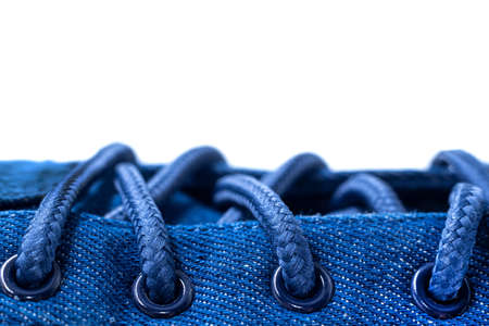 Shoe laces. Lace-up casual or sports shoes close-up on a white background. shoes backgroundの写真素材