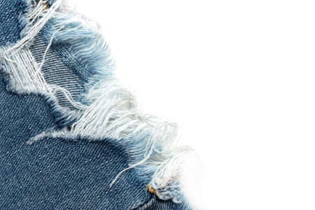 Frayed ripped jeans on a white background. Denim frame with empty space for inscription
