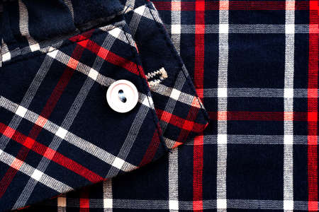 Men's checkered material shirt sleeve. Piece of clothingの写真素材