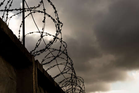 Prison. Prison wall with barbed wire. law and justice