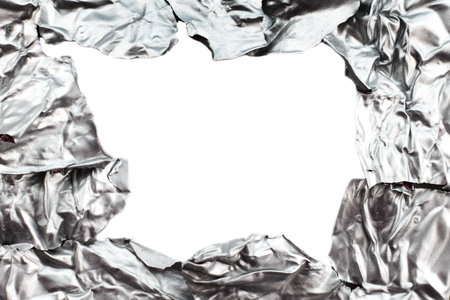 Foil background with a hole for an inscription close-up. Foil texture with empty spaceの写真素材