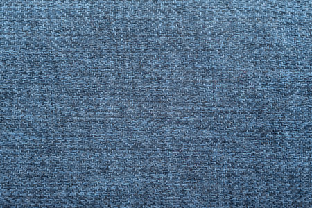Close-up long and wide texture of natural blue fabric or cloth in light blue color. Fabric texture of natural cotton or linen textile material. blue canvas backgroundの写真素材